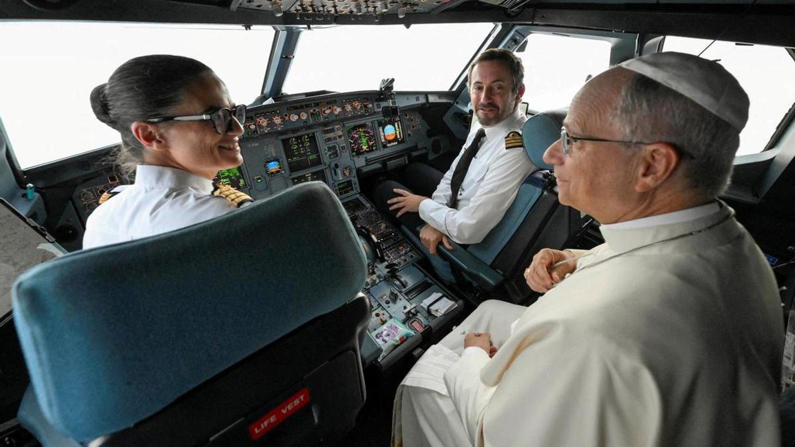 Pope Leo speaks with the pilots on his flight to Metz from Lourdes, on the last day of his four-day visit to France.