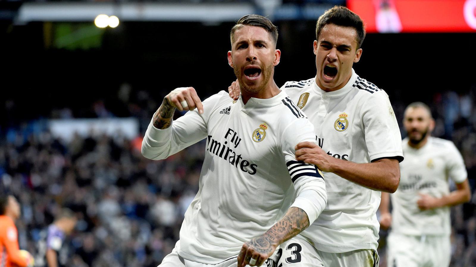 Sergio Ramos and Sergio Reguilón celebrating a goal.