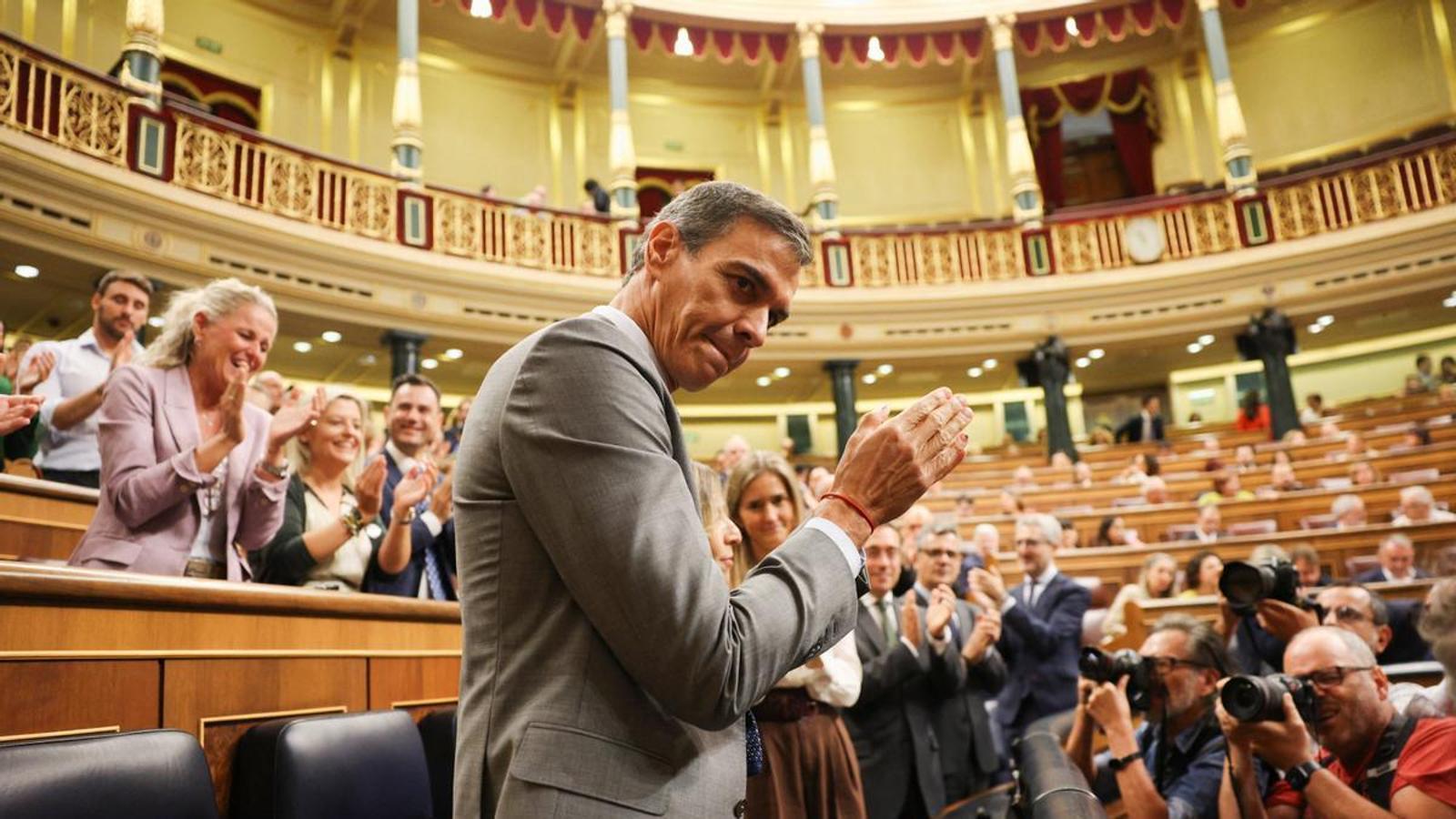 The president of the Spanish government, Pedro Sánchez, reacts to the applause of his group, during the voting session of two government decrees approved by the Council of Ministers this week —which include a package of social and housing measures, such as protection against the evictions of vulnerable tenants until 2030— at the Congress of Deputies in Madrid, Spain, on October 2, 2026