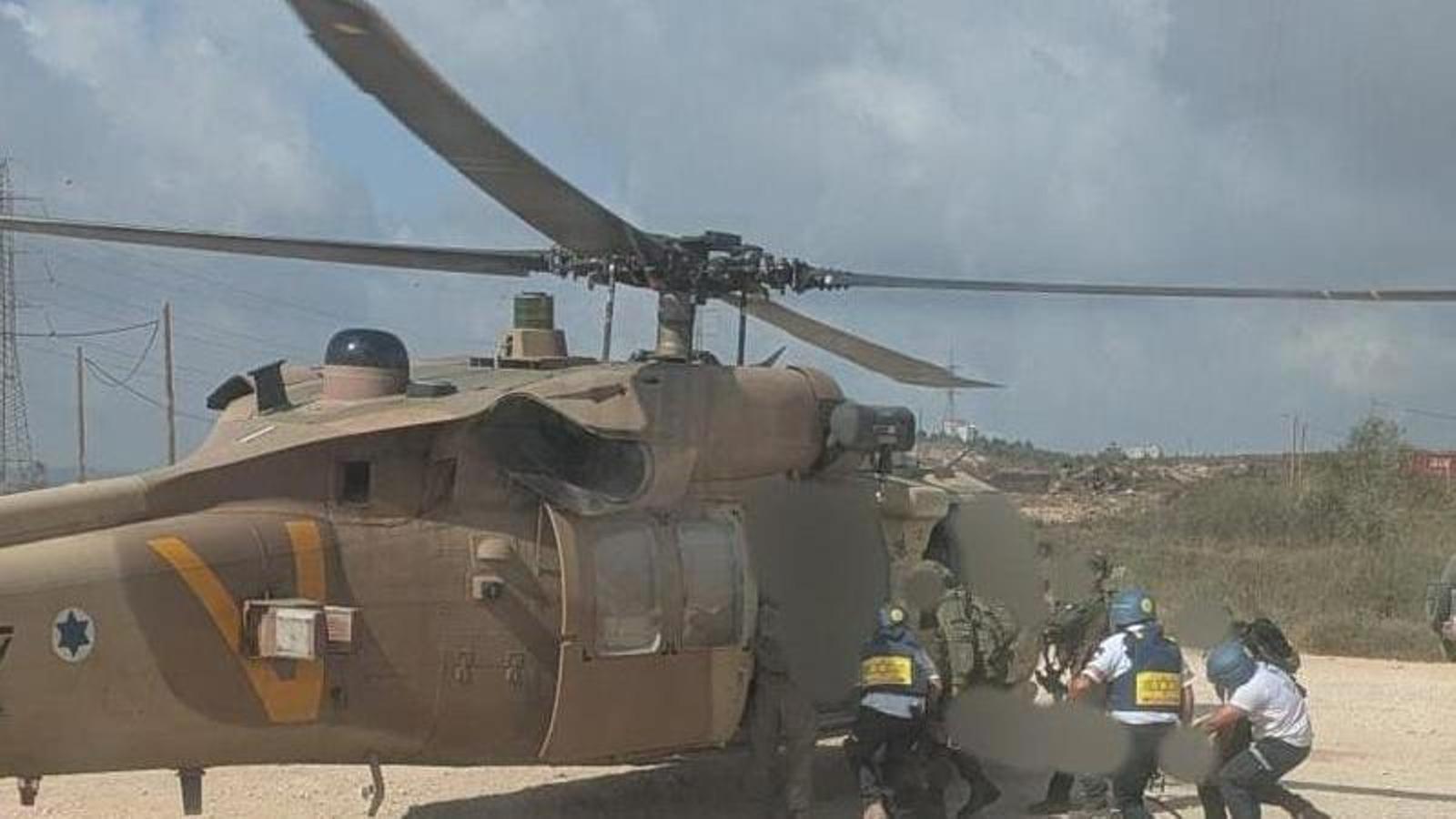 Israeli emergency services evacuate by helicopter an Israeli injured during a shooting in the Palestinian village of Tell, which has killed four Palestinians and one Israeli.