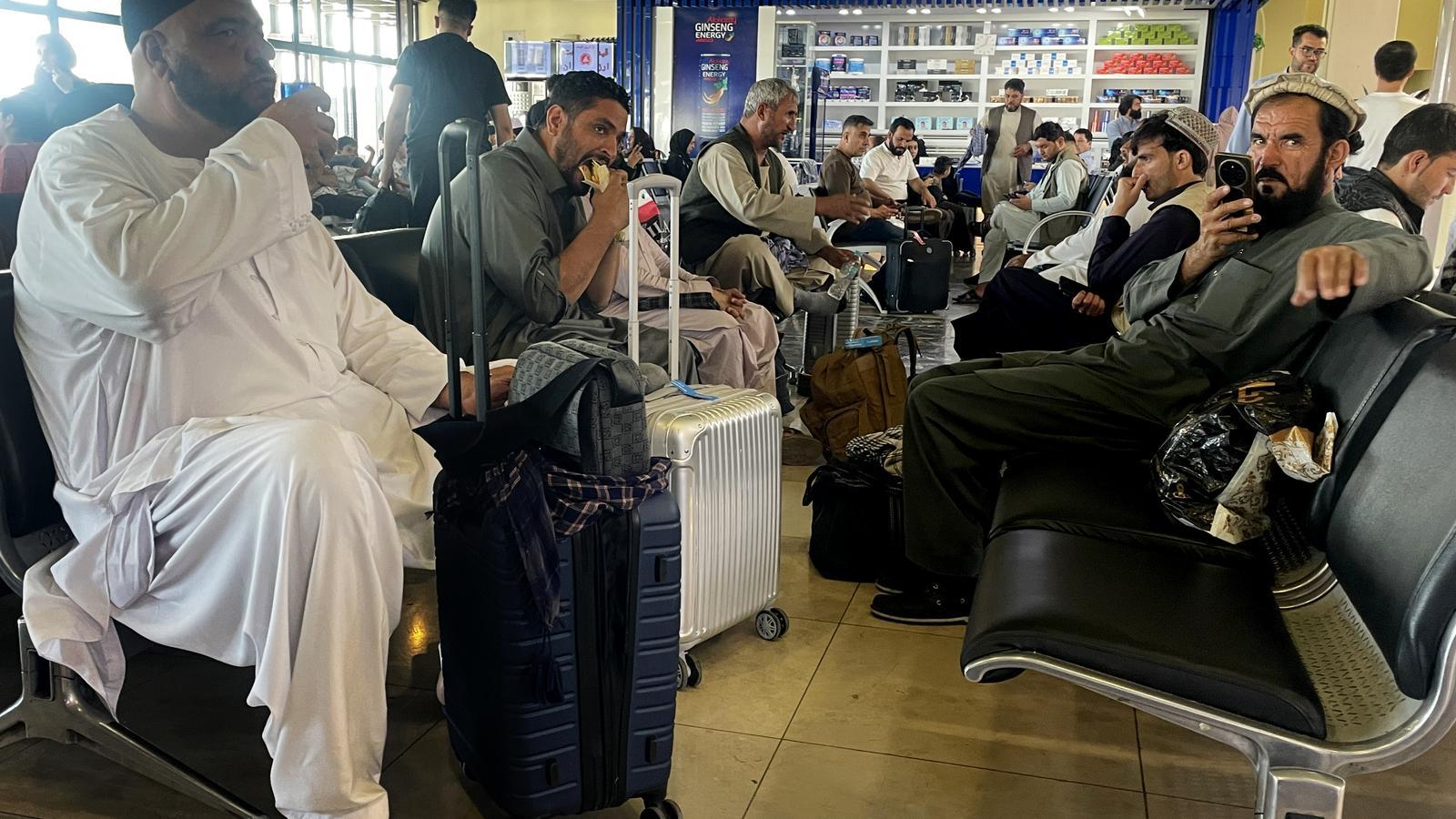 Afghans, waiting to board at Kabul airport last week.