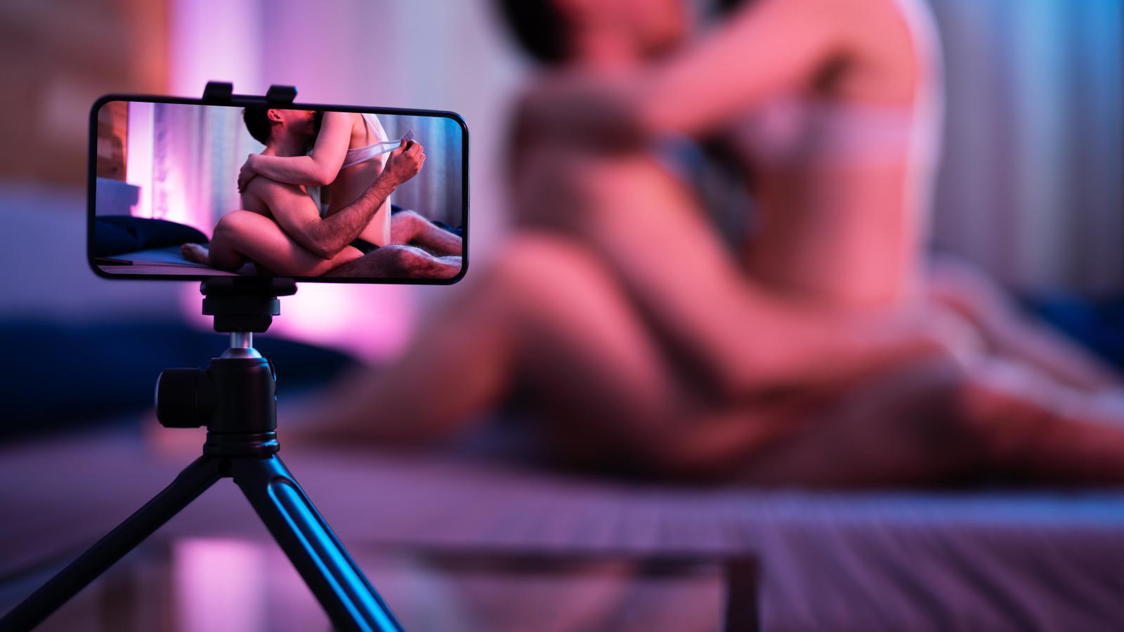An amateur couple films themselves in a sex scene