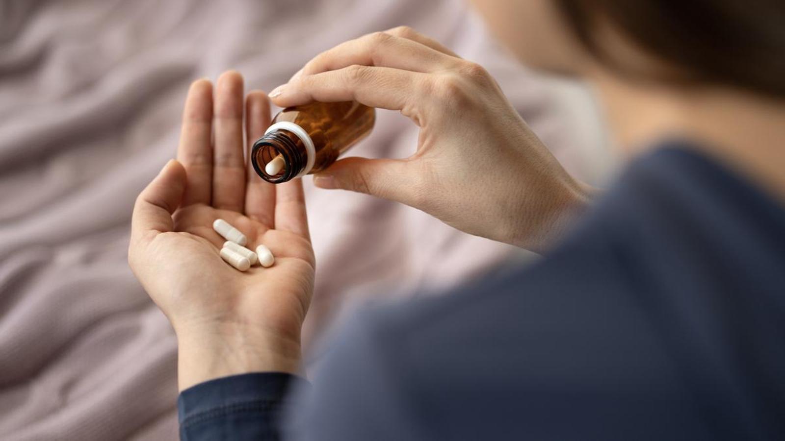 A person takes antidepressants