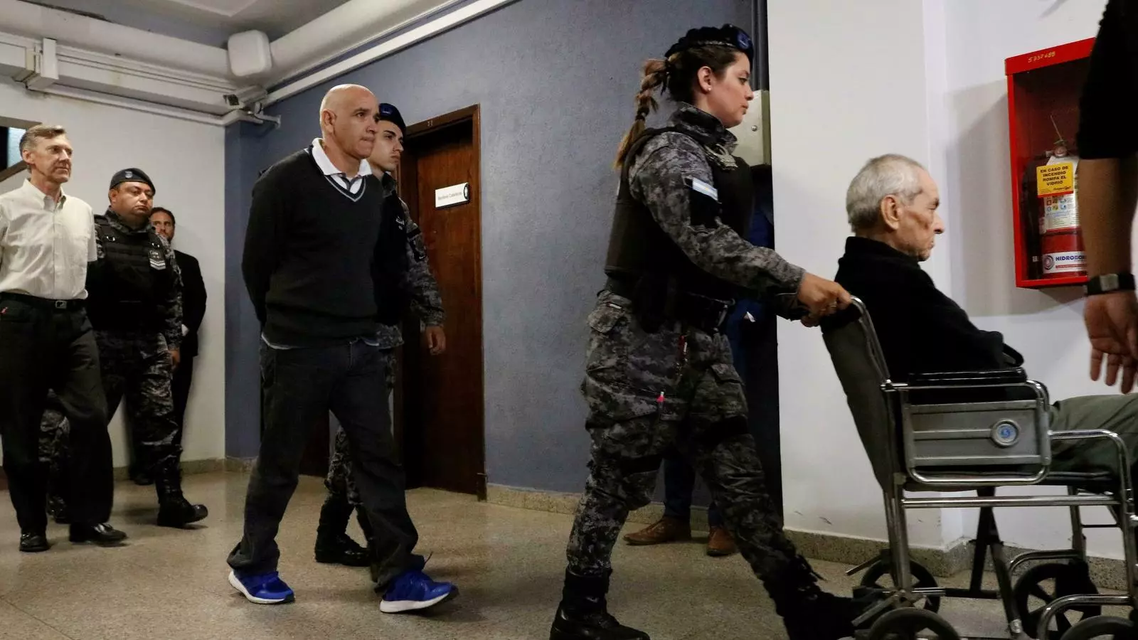 Nicola Corradi, Armando Gómez i Horacio Corbacho surten de l'audiència del Tribunal Penal