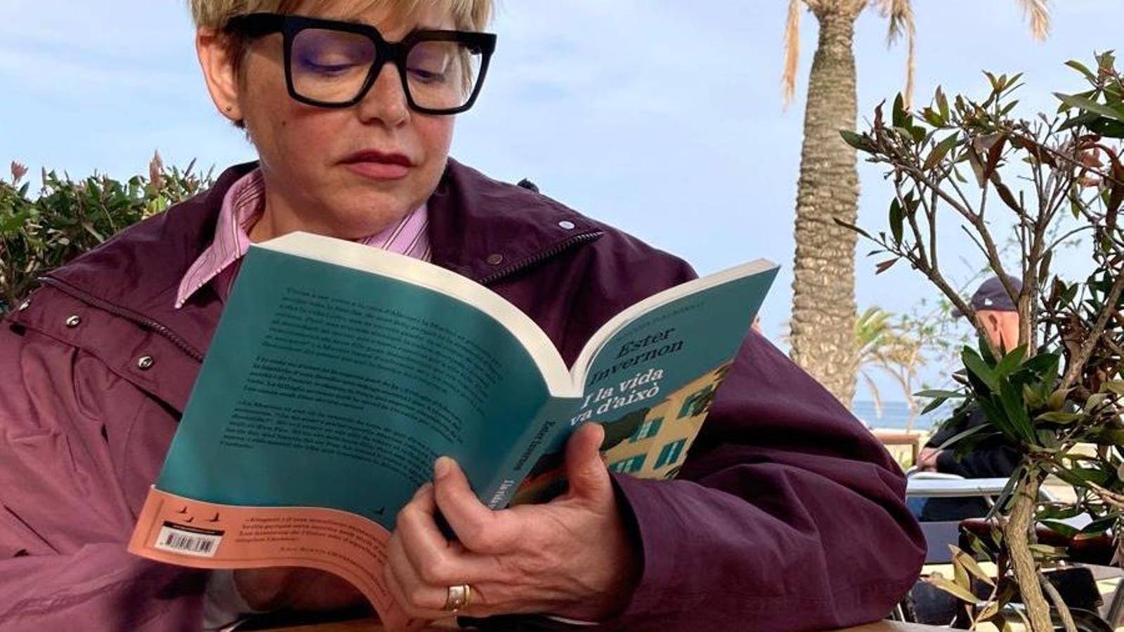 Ester Invernon reading one of her books.