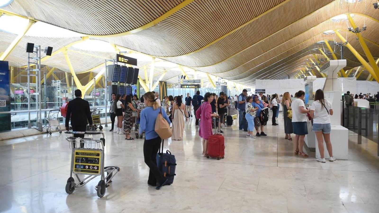 People waiting at Barajas Airport.