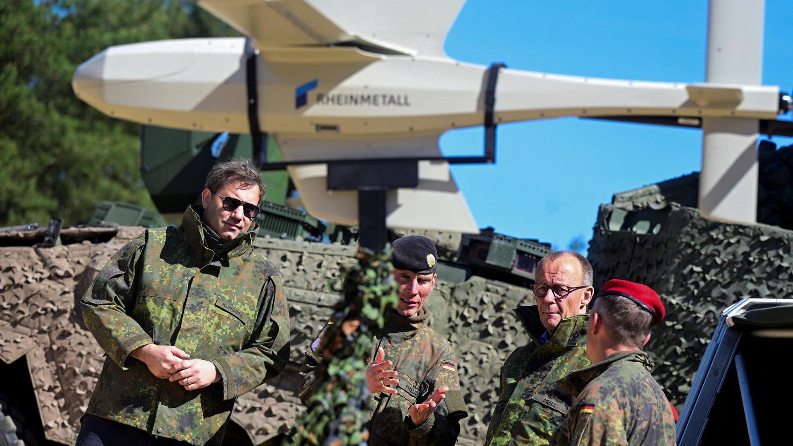 The German Minister of Finance, Lars Klingbeil, and the German Chancellor, Friedrich Merz, participate in a military training at a military base of the German army, the Bundeswehr, in Munich, Germany.