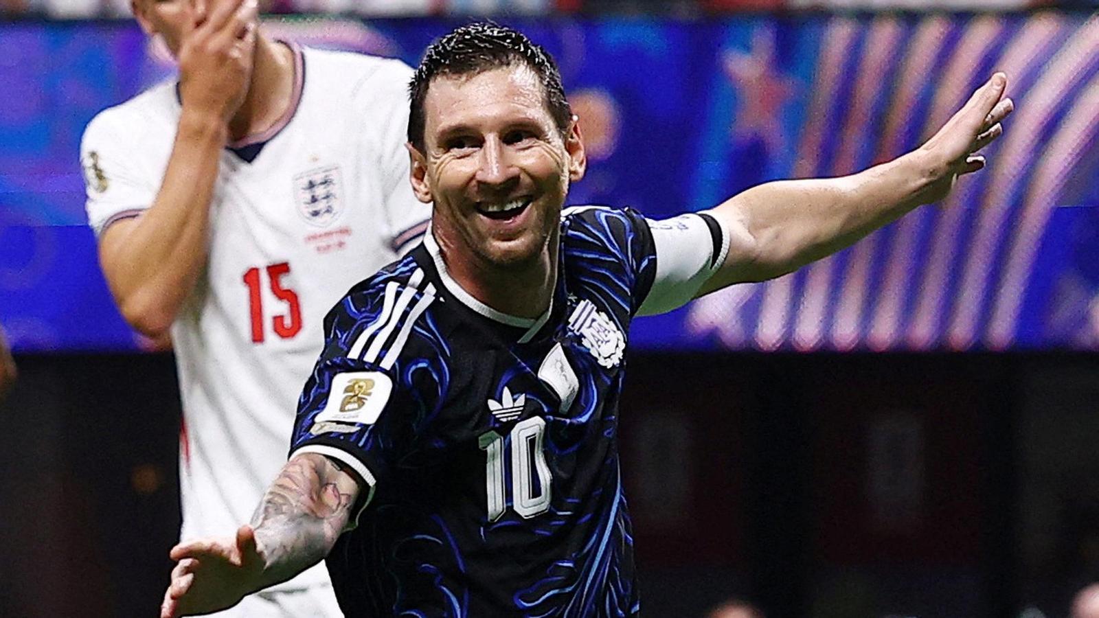 Lionel Messi, from Argentina, celebrates it after Enzo Fernández scores the team's first goal.