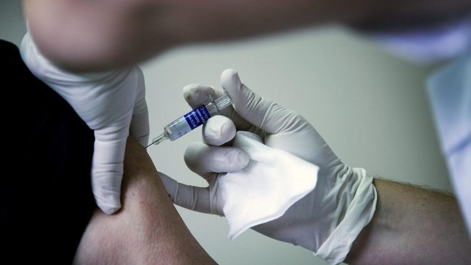 A health worker vaccinating in an archive image.