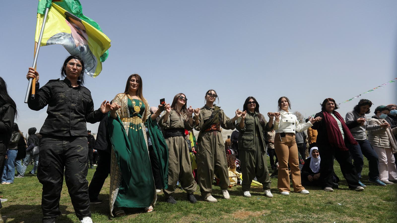 Kurdish fighters celebrate the military parade commemorating the 13th anniversary of the founding of the Women's Protection Units (YPJ) in Qamishli, Syria, this Saturday.