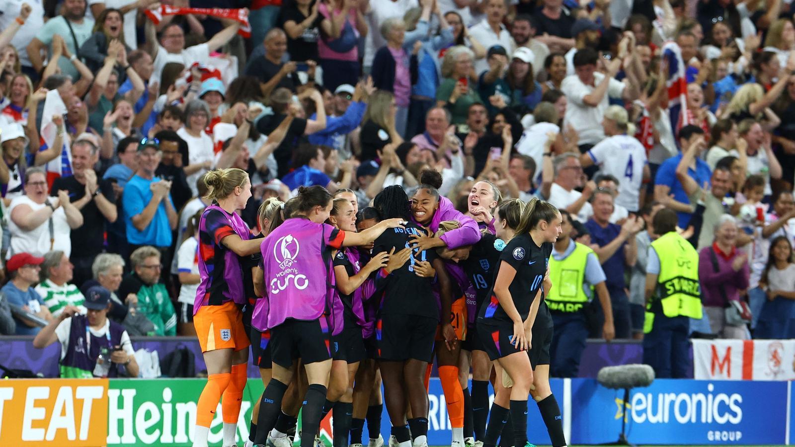 England celebrates the equalizing goal against Italy.