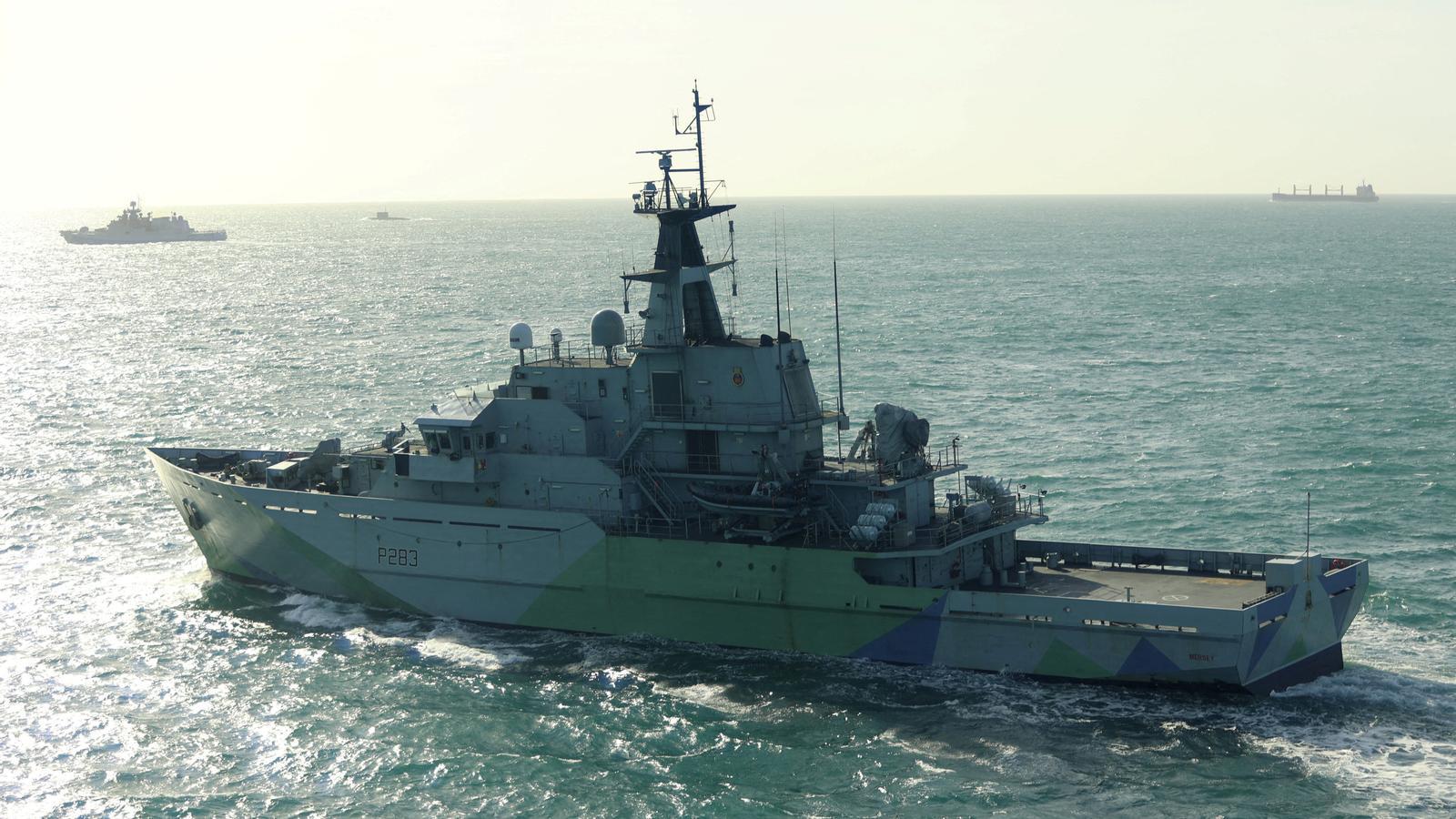 The British Royal Navy's 'HMS Mersey' tracks the Russian frigate 'Admiral Grigorovich' and the Russian Navy submarine 'Krasnodar' in an unknown location, in an archive image.