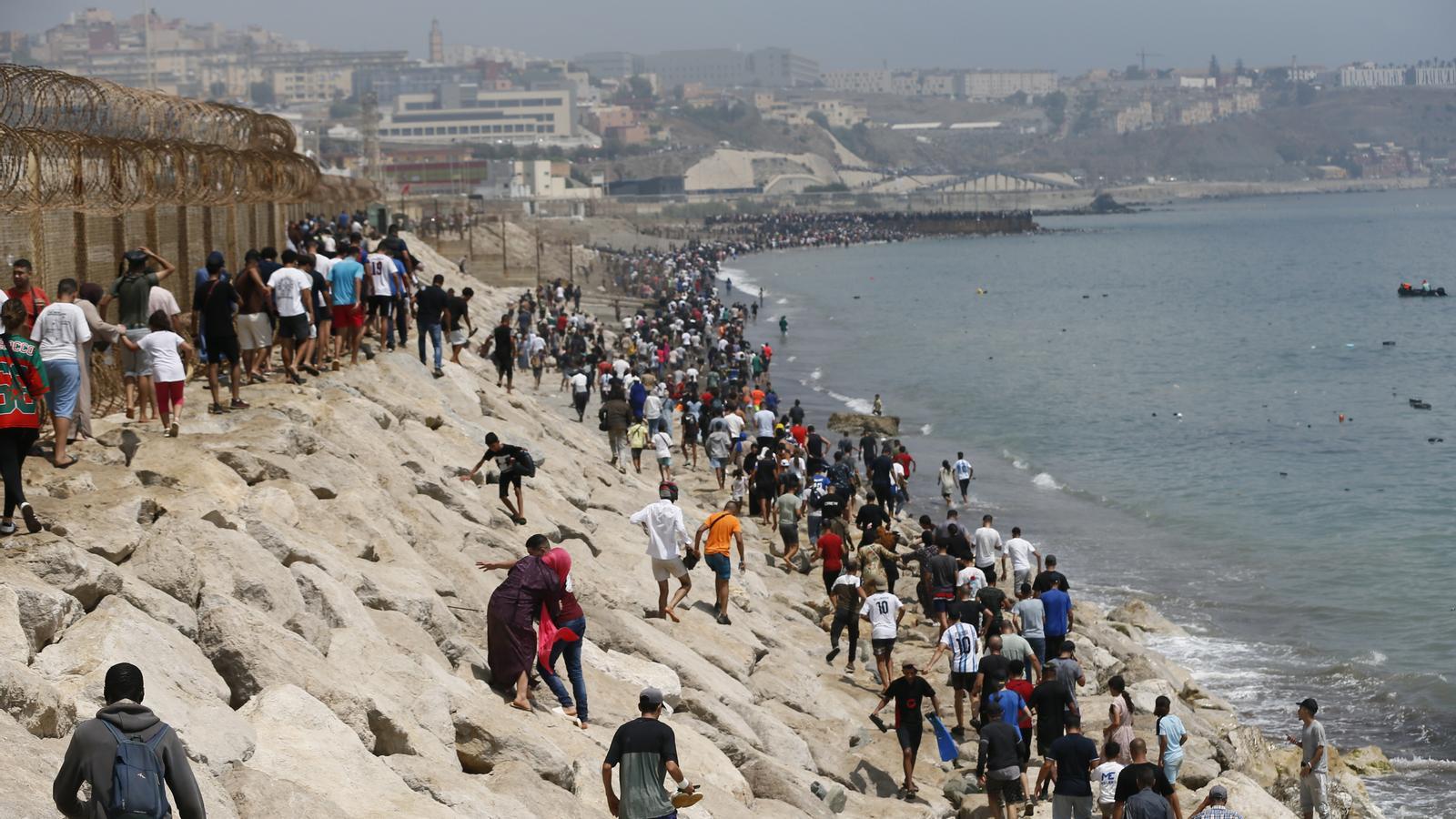 Thousands of Moroccan youths crossing the border between Morocco and Ceuta