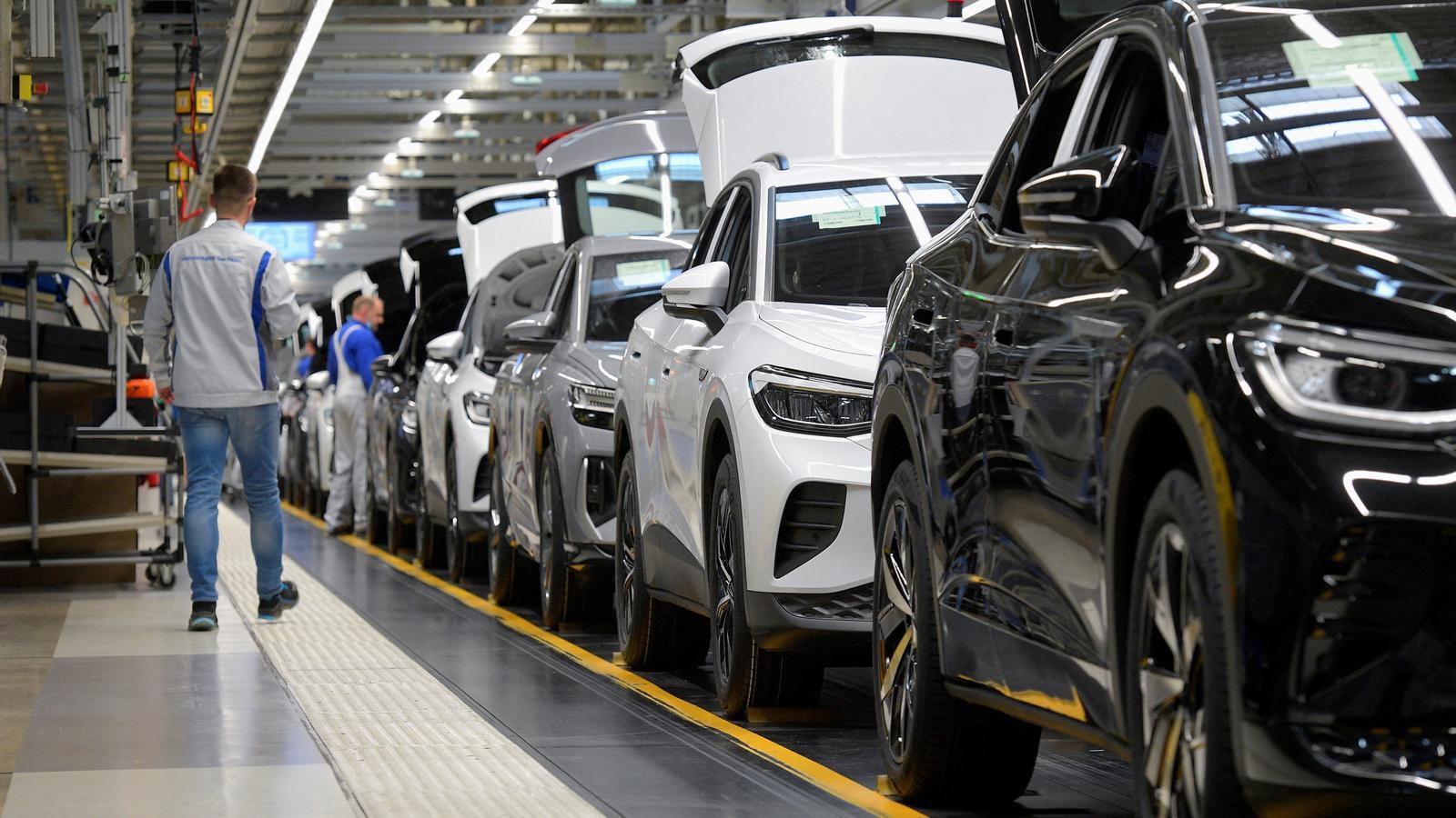 Technicians working on the electric car model production line of the Volkswagen Group in Zwickau, Germany.