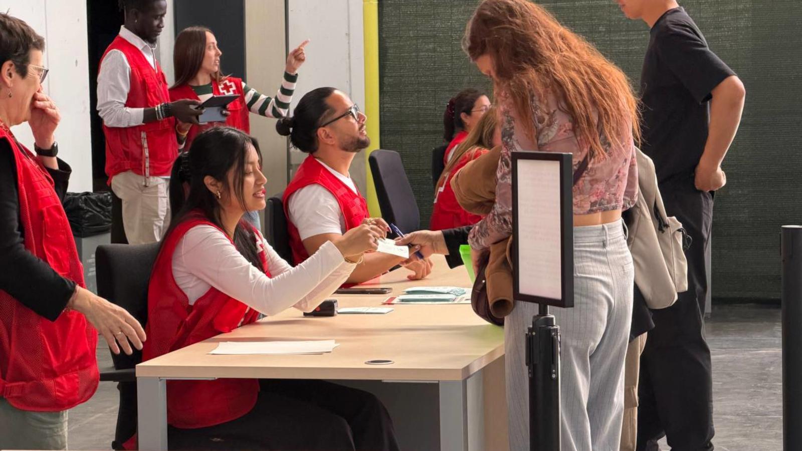 Immigrants carrying out regularization procedures in the space set up at Fira de Barcelona.