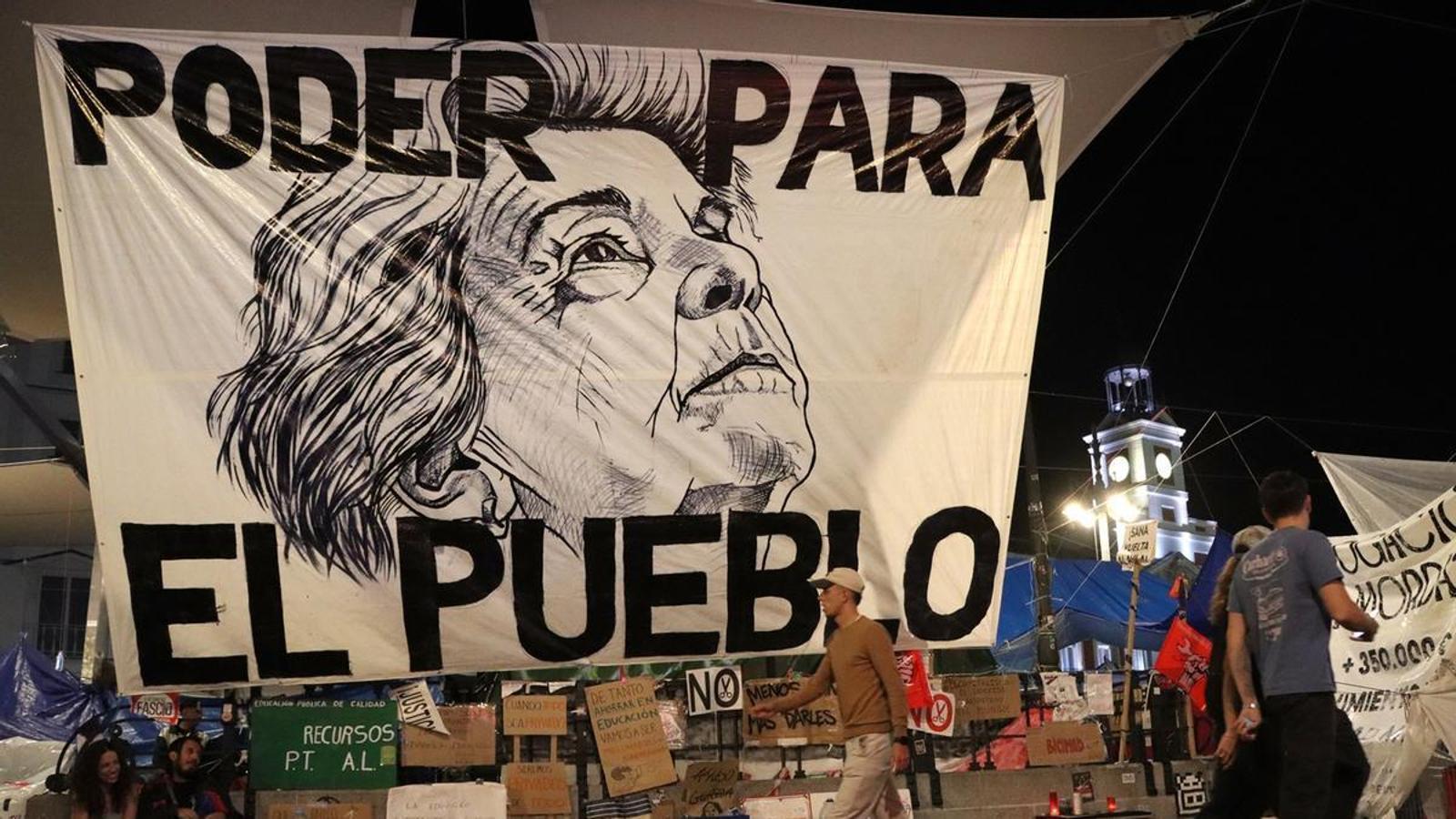 A banner with the face of Maricarmen Abascal, Thursday, October 15, at Puerta del Sol, Madrid.