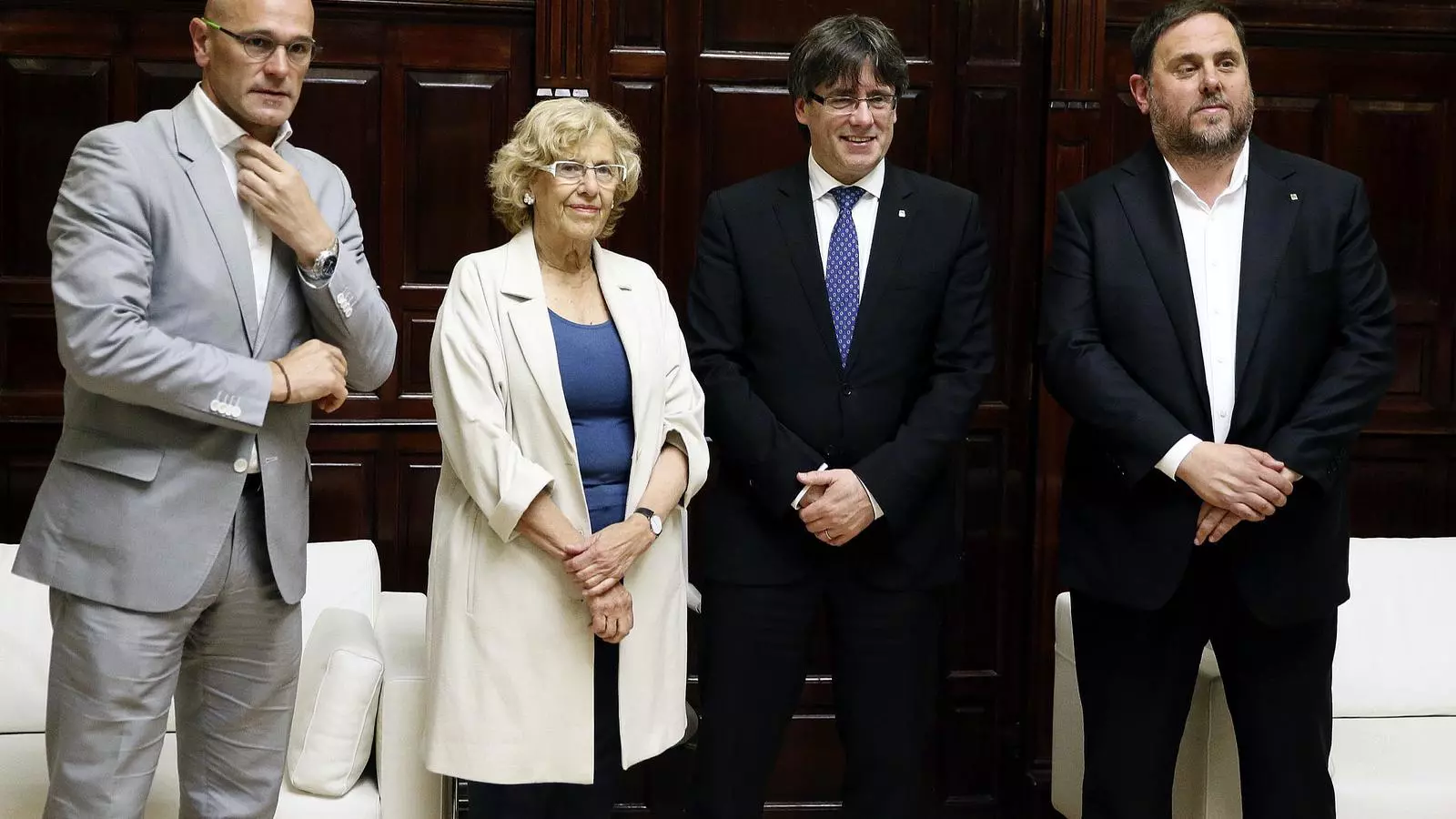 Raül Romeva, Manuela Carmena, Carles Puigdemont y Oriol Junqueras en la conferencia en Madrid del 2017.