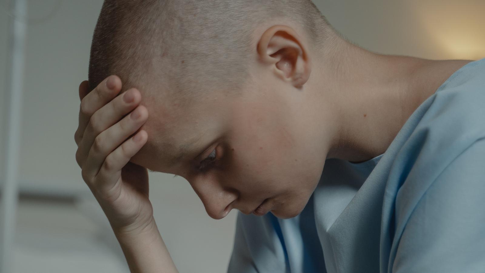 A resource image of a person with their hand on their head. They look at the ground with a gesture of worry.