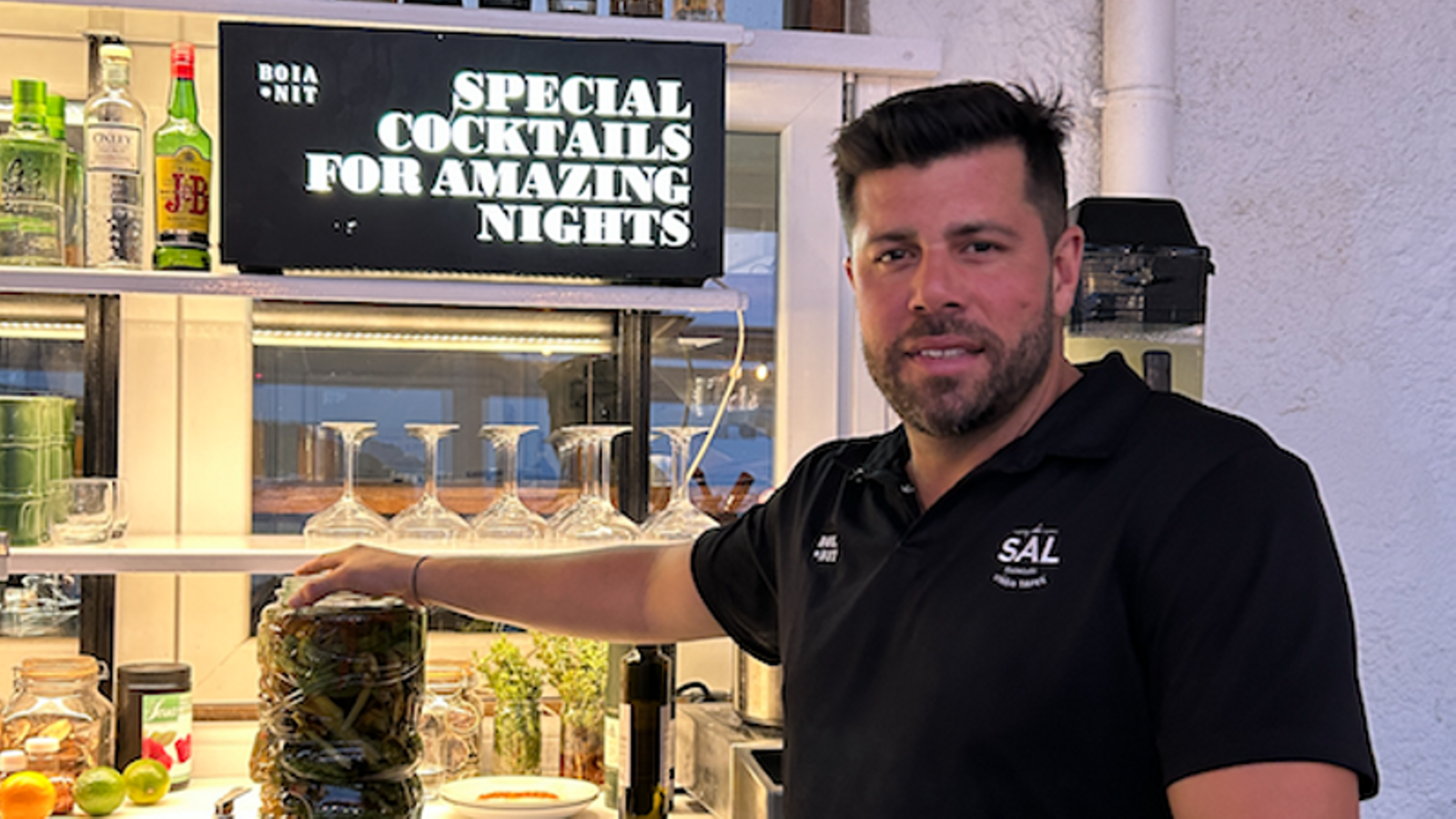 Cocktail maker Manel Vehí, from the former Bar Boia, has just opened the seafront bar La Sal. Pictured here, he's holding the ratafia he'd just made.
