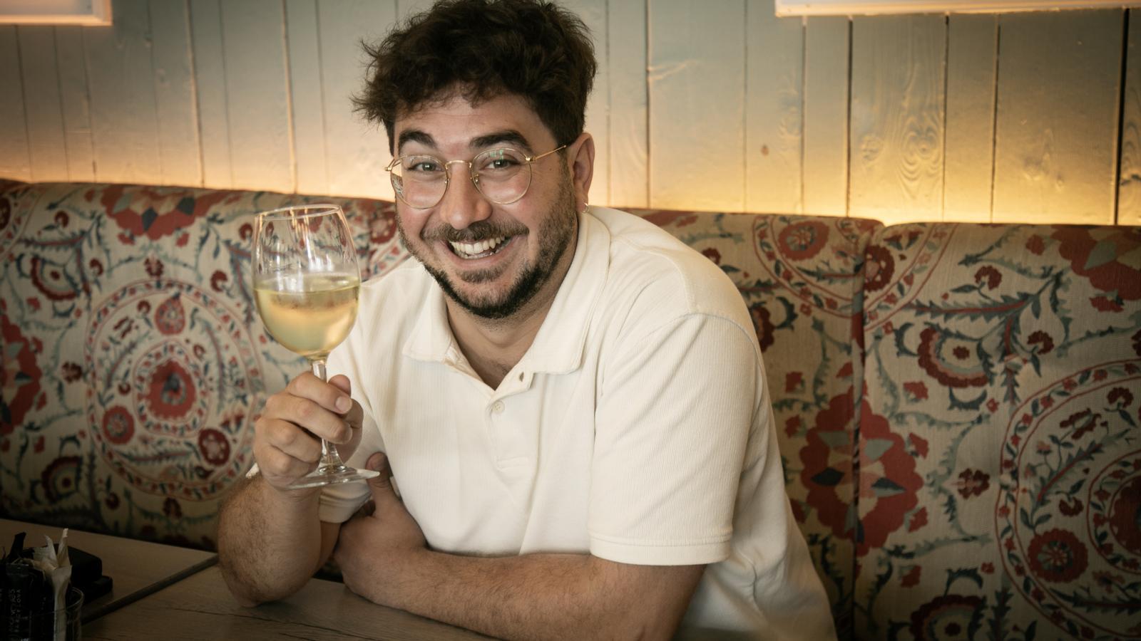 Guillem Estadella photographed with a glass of white wine