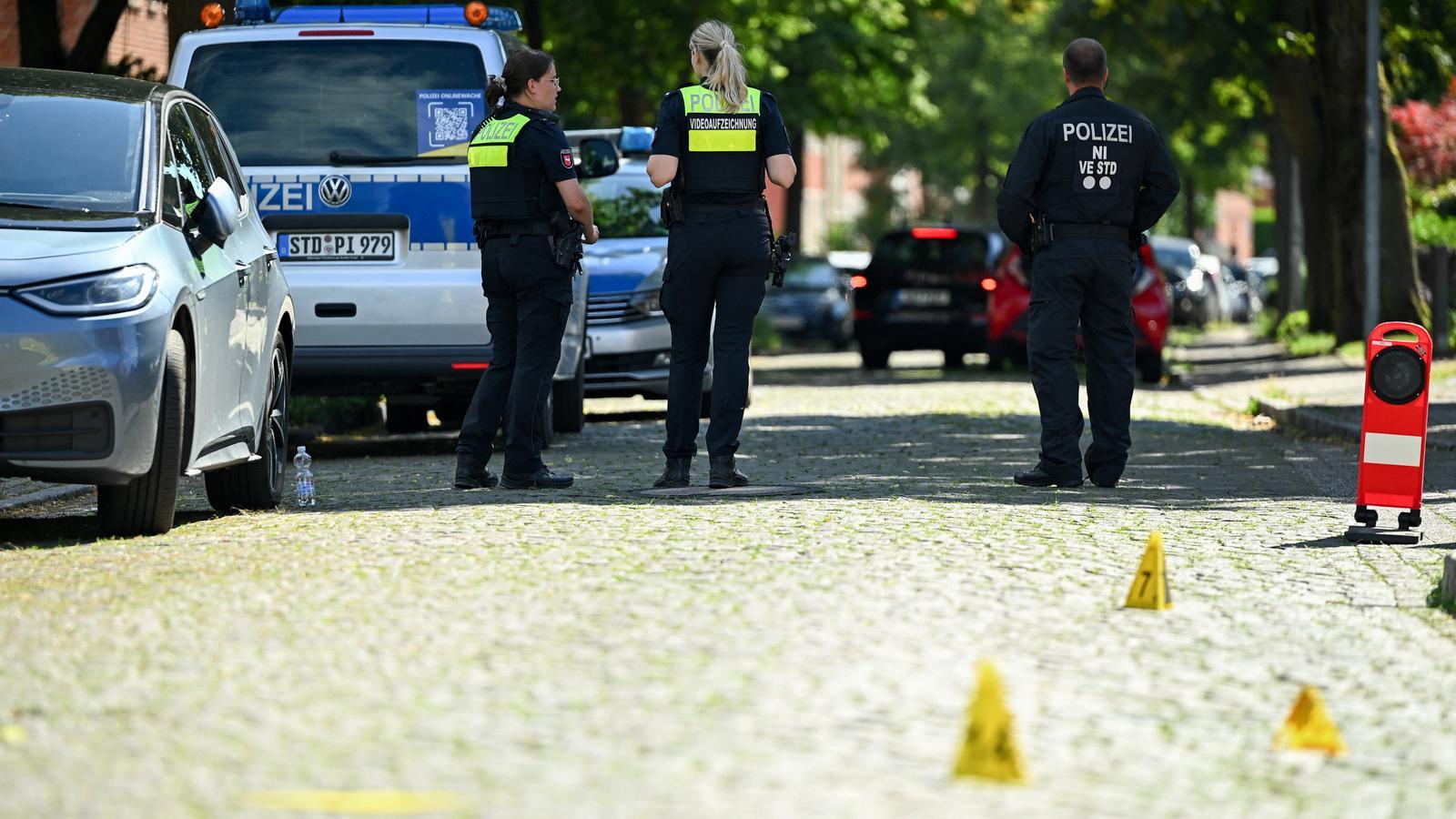 Police officers work at the crime scene after the arrest of suspects in a fatal shooting at a youth welfare center in the city of Stade (Germany).