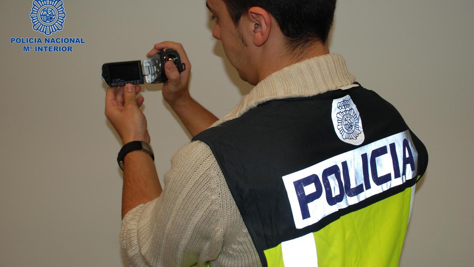 A CNP agent with the confiscated camera