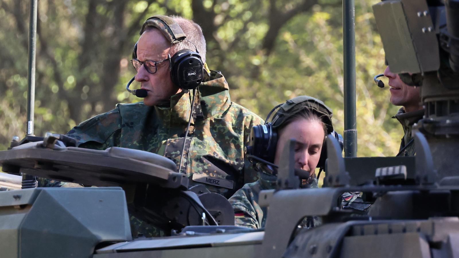 The German Chancellor, Friedrich Merz, on the left, in a Boxer armoured vehicle during a German Armed Forces (Bundeswehr) exercise in Münster, on April 30, 2026.