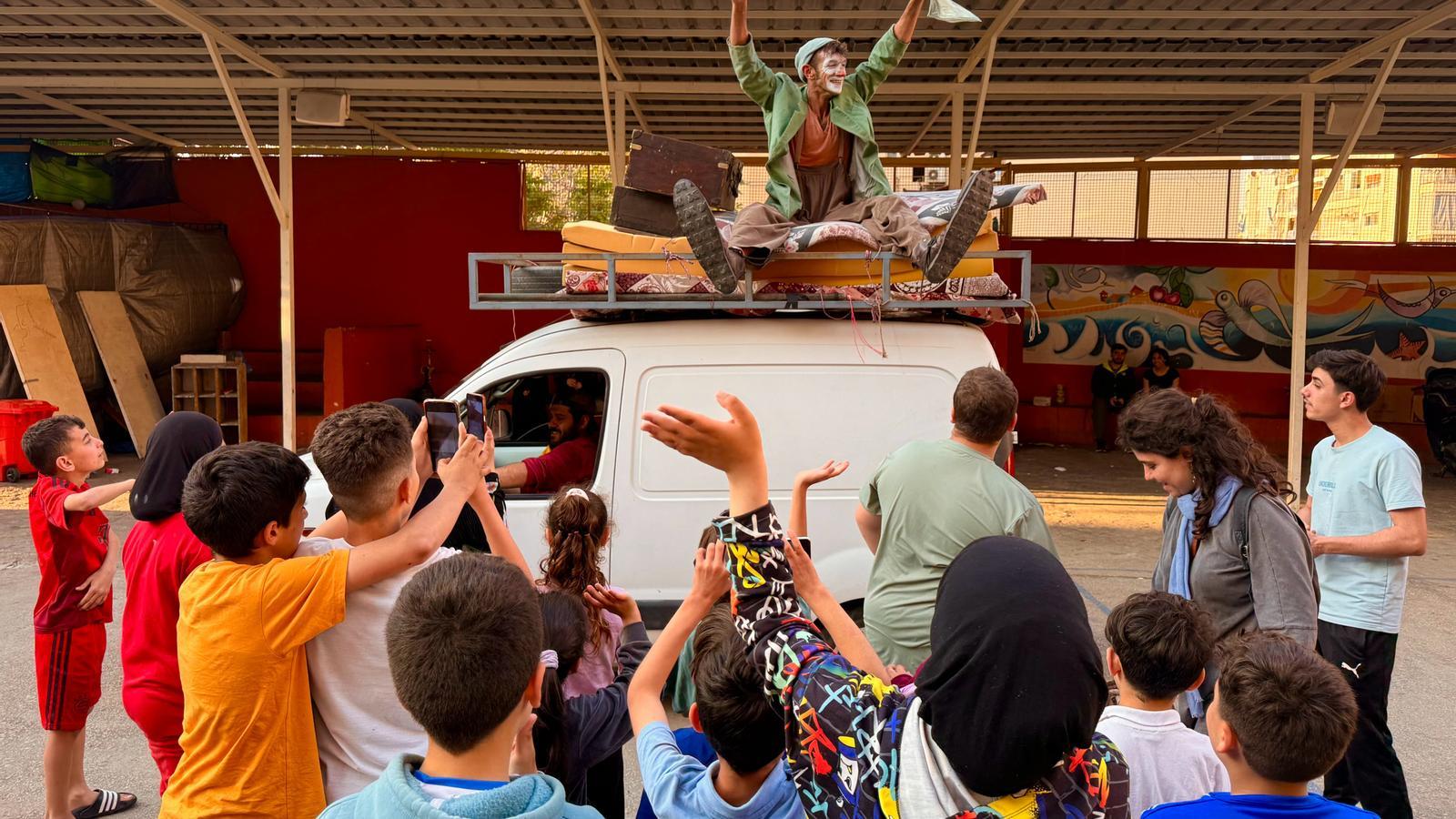 The clown Pau Palaus acts in front of a group of young Lebanese people