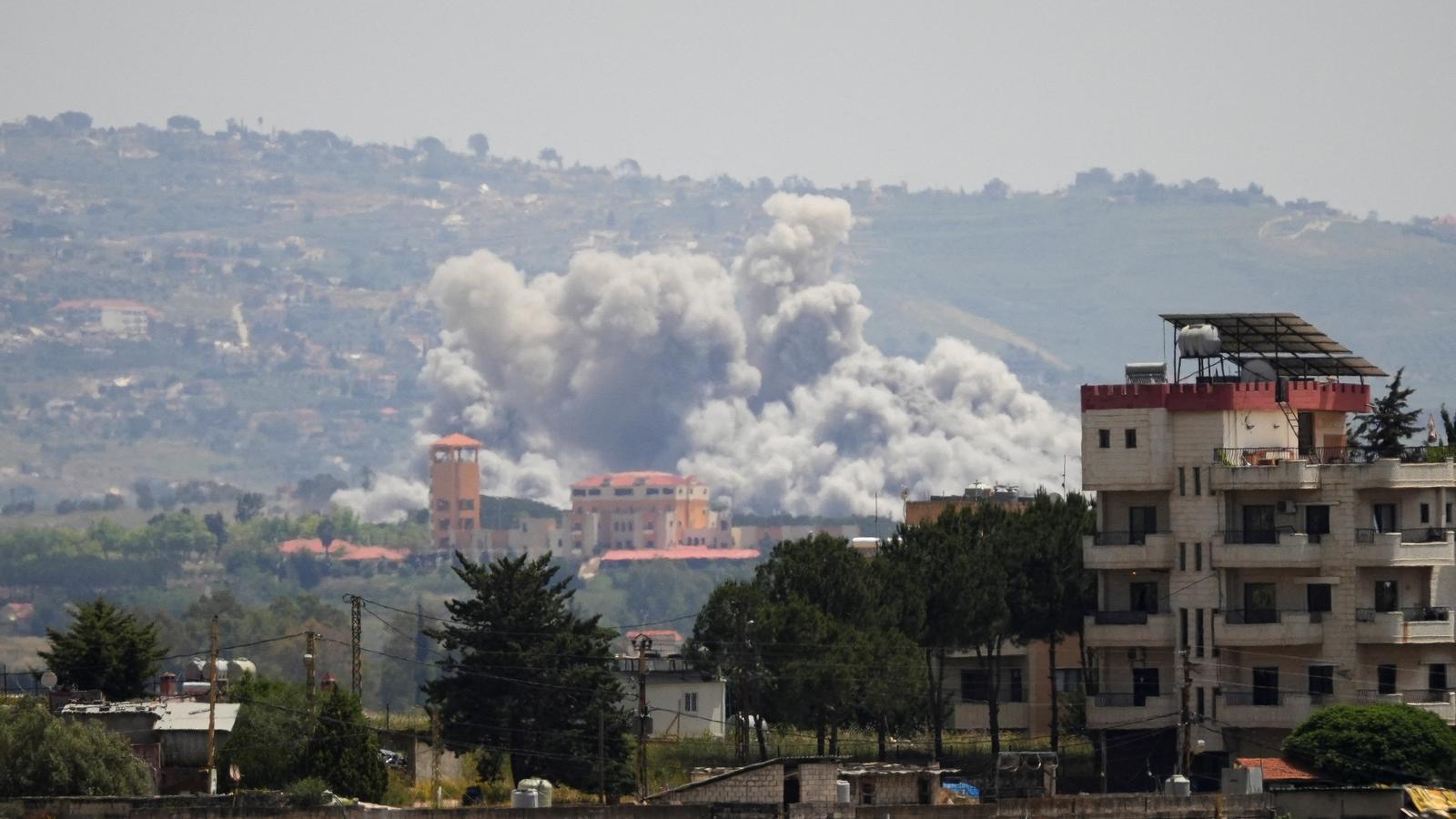 A column of smoke rises over Nabatieh after an attack by Israel.
