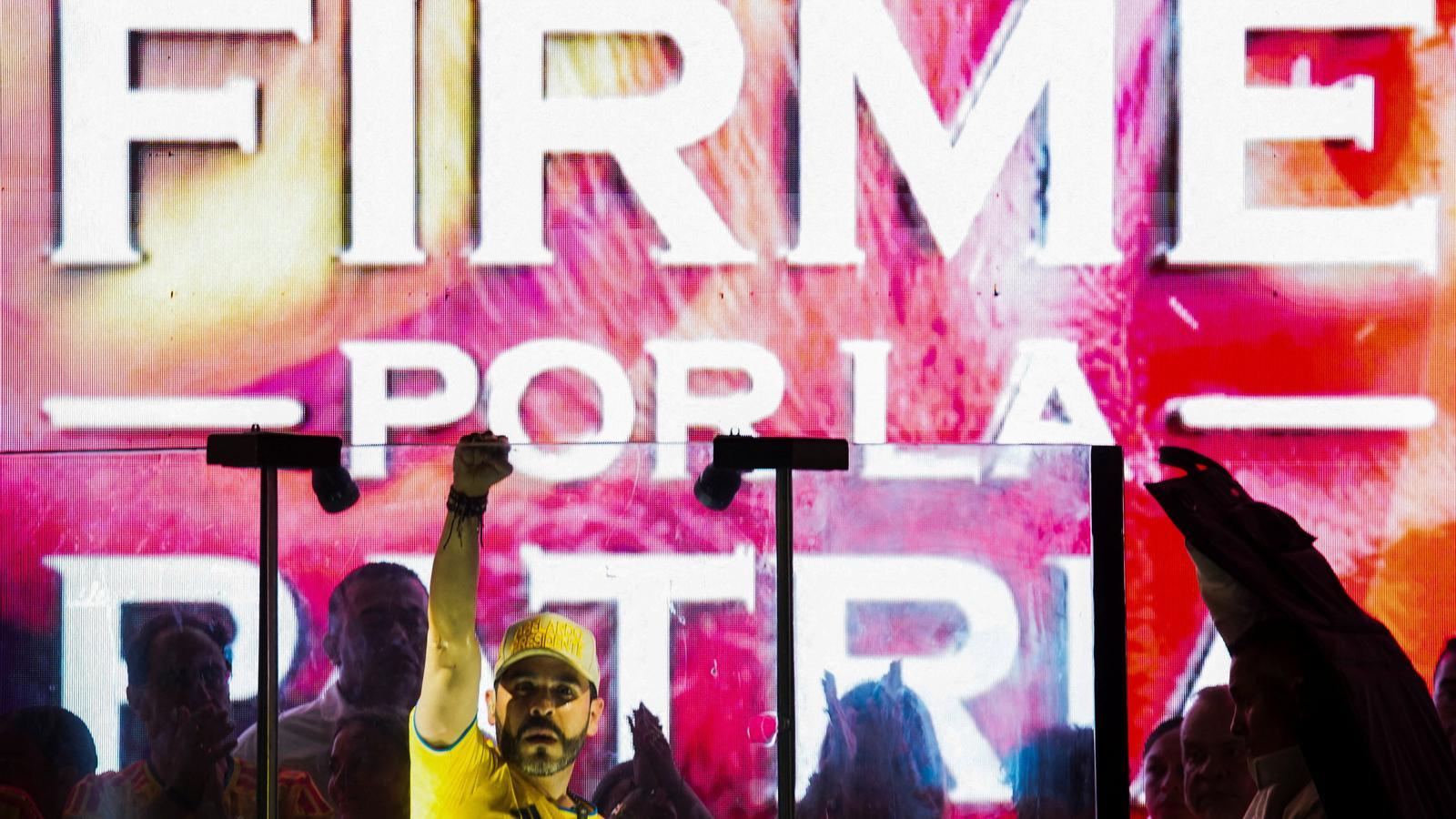 Colombian presidential candidate Abelardo De La Espriella, from the political movement Defensors de la Pàtria, greets his supporters after the results of the first round of the presidential elections, in Barranquilla, Colombia
