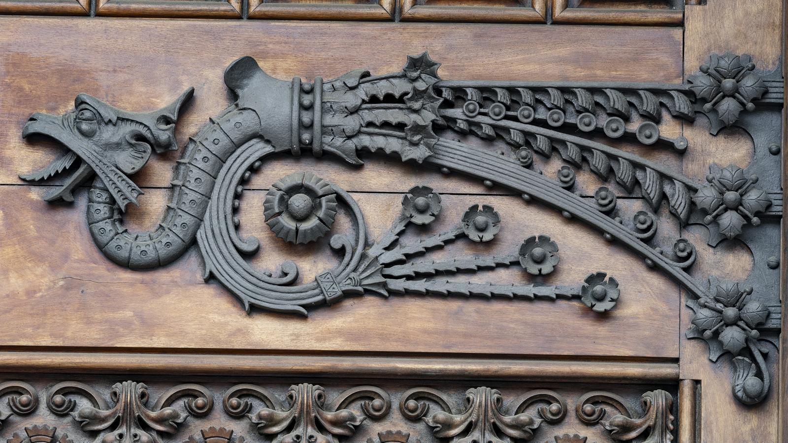 A dragon on a door of a house on Gran Via de les Corts Catalanes, in Barcelona.