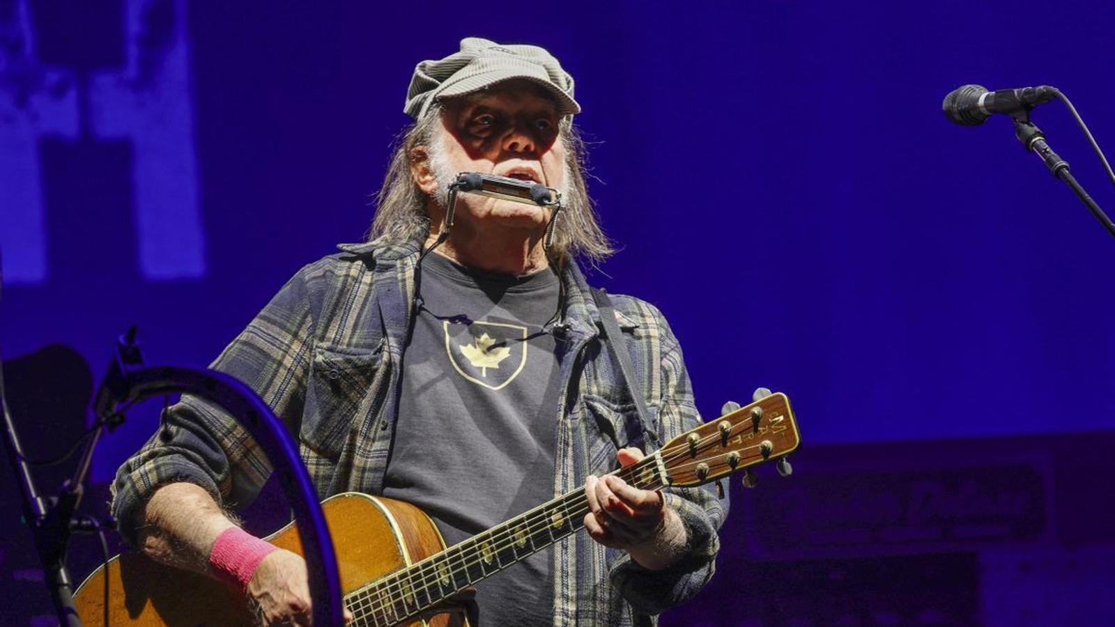Singer-songwriter Neil Young performing with his band Chrome Hearts on the Pyramid Stage during the 2025 Glastonbury Festival.