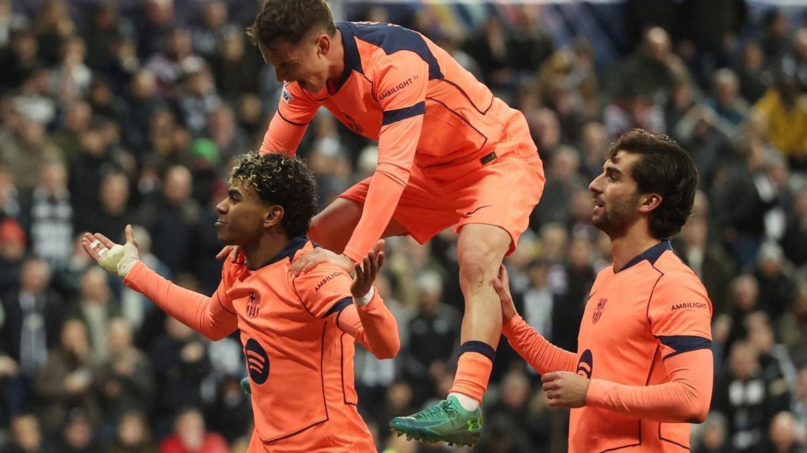 Lamine Yamal celebrates his goal with Marc Casadó and Ferran Torres during the Champions League round of 16 match against Newcastle at St James' Park.