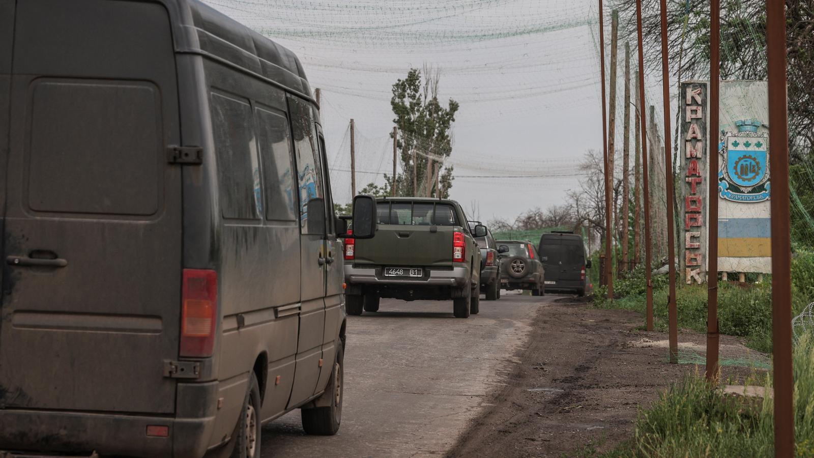 Military vehicles advance on a road in Kramatorsk, in the Donetsk region, in Ukraine.