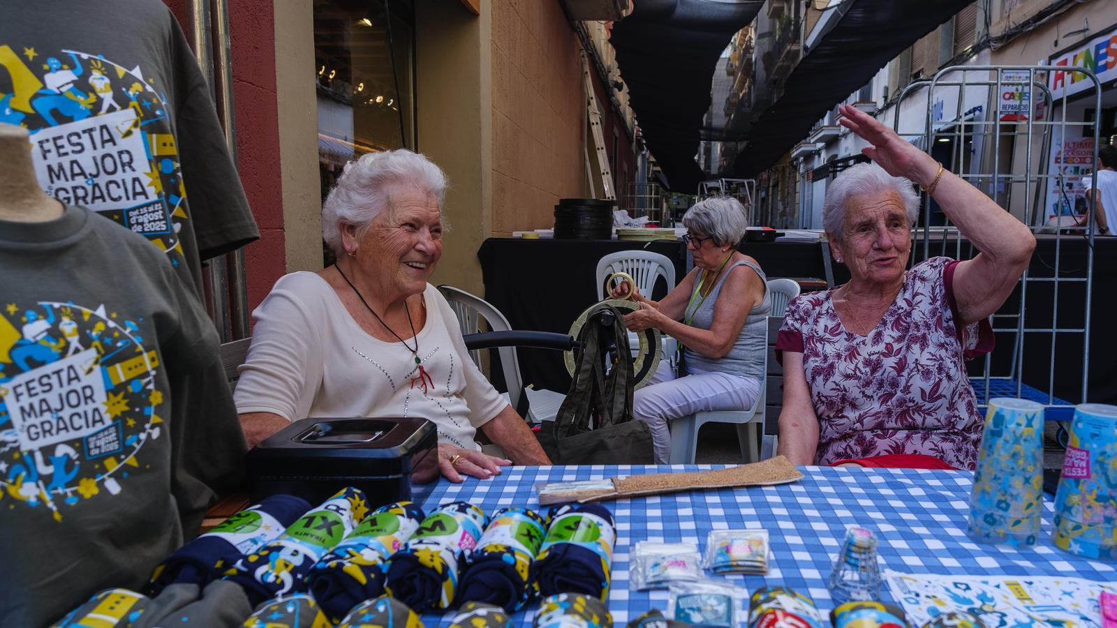 Montserrat, Maria Teresa, and Lolita decorate Berga Street for the Gràcia festival.