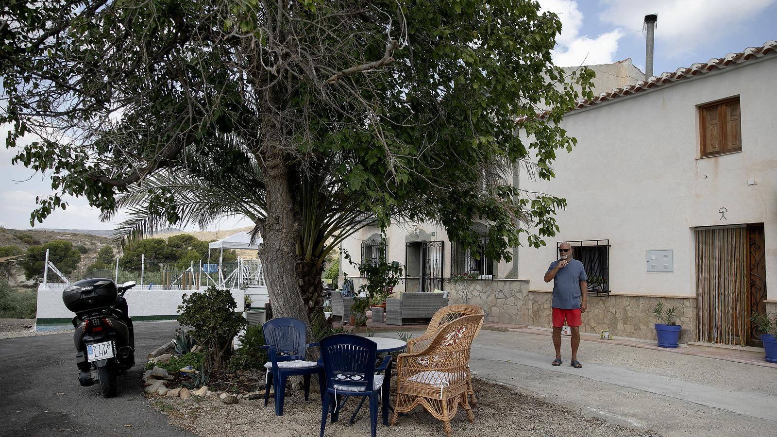 Andrew at the entrance of his house, in Los Gallardos.