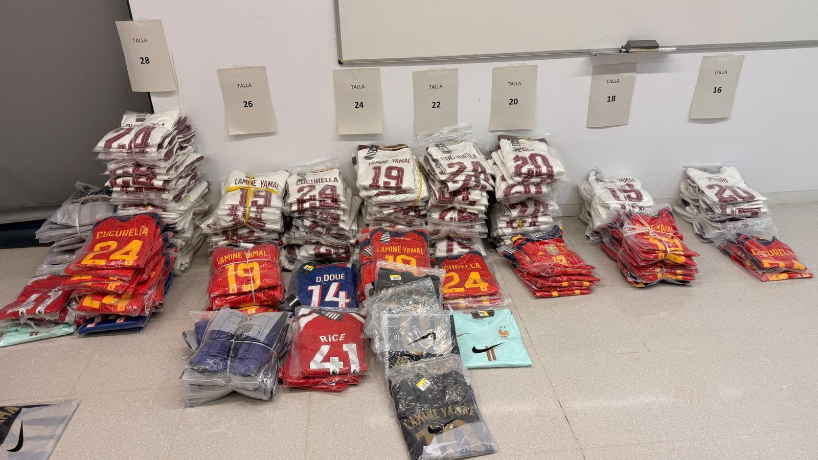 Image of allegedly counterfeit sports t-shirts seized by the Mossos d'Esquadra
