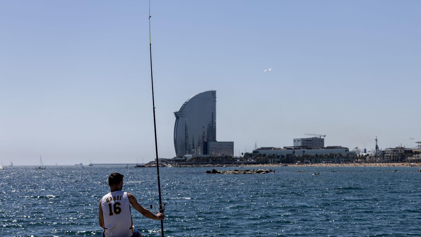 A fisherman in front of the W Hotel in Barcelona