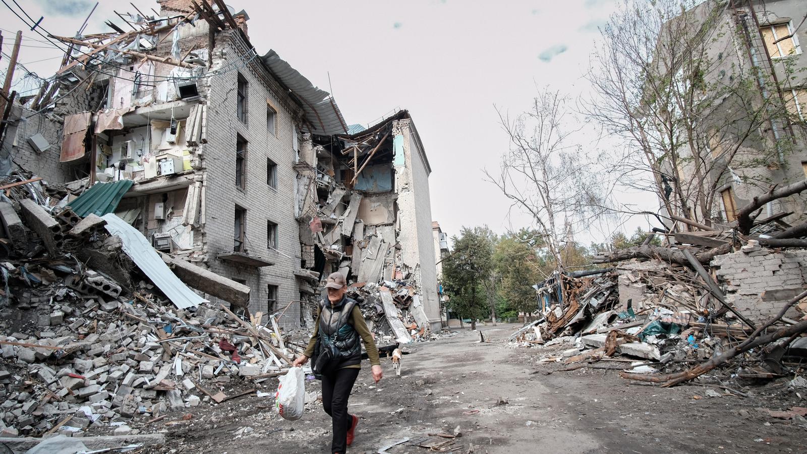 A woman walking along a street in Sloviansk.