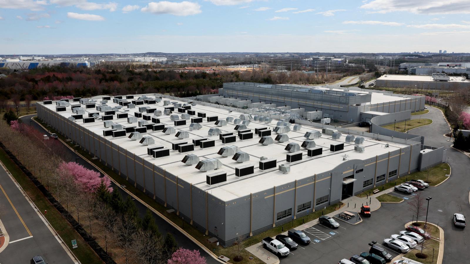 A car passes in front of a Digital Reality data center building in Ashburn, Virginia (USA), on March 17, 2025.