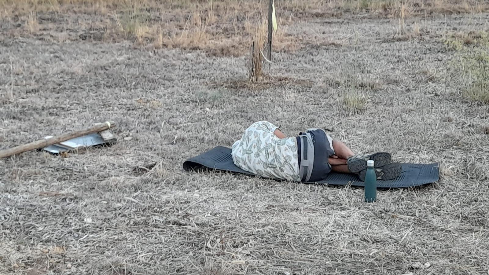 A young man sleeping after the party.