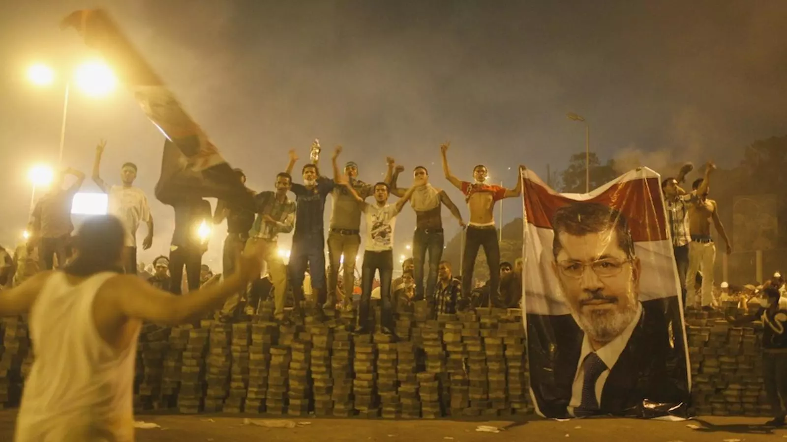 Imatges de suport a Mursi en una barricada a Ciutat Nàsser, al Caire. REUTERS