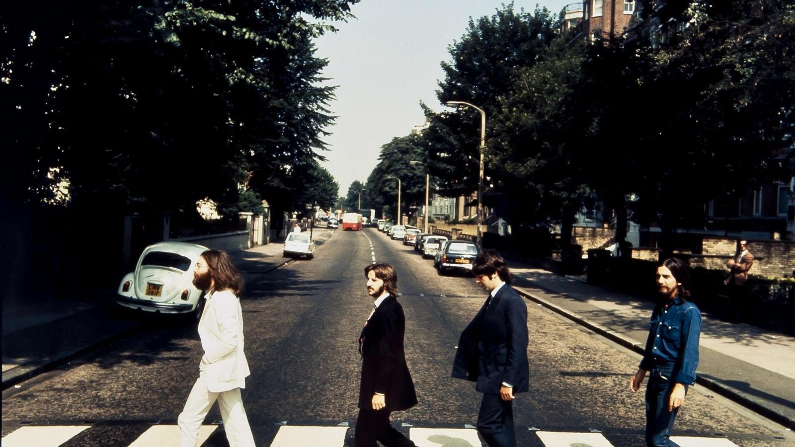 John Lennon, Ringo Starr, Paul McCartney and George Harrison on the iconic Abbey Road zebra crossing.