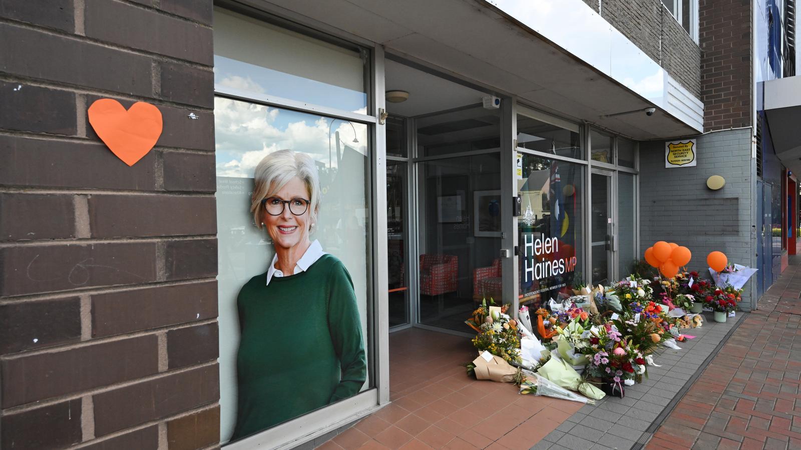 Citizens have brought flowers in tribute to independent federal member Helen Haines in front of her electoral office in Wangaratta, Australia, after she suffered an intentional hit-and-run yesterday.