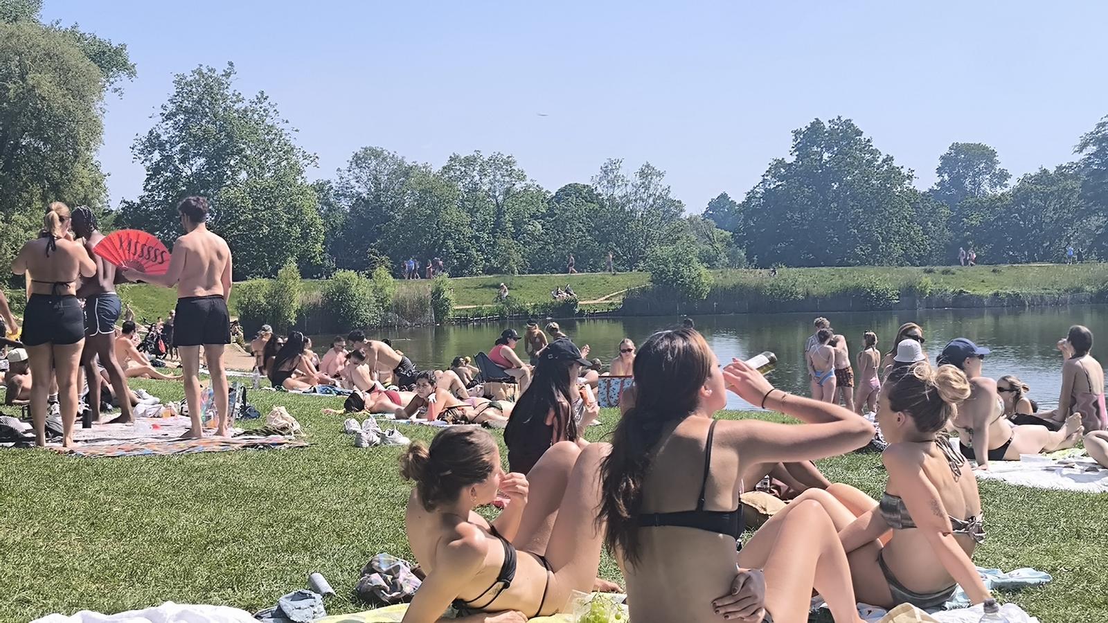 Various groups of people gather on Parliament Hill, in north London, during an unusual heatwave in the United Kingdom that has exceeded 30 degrees in the southeast of England.
