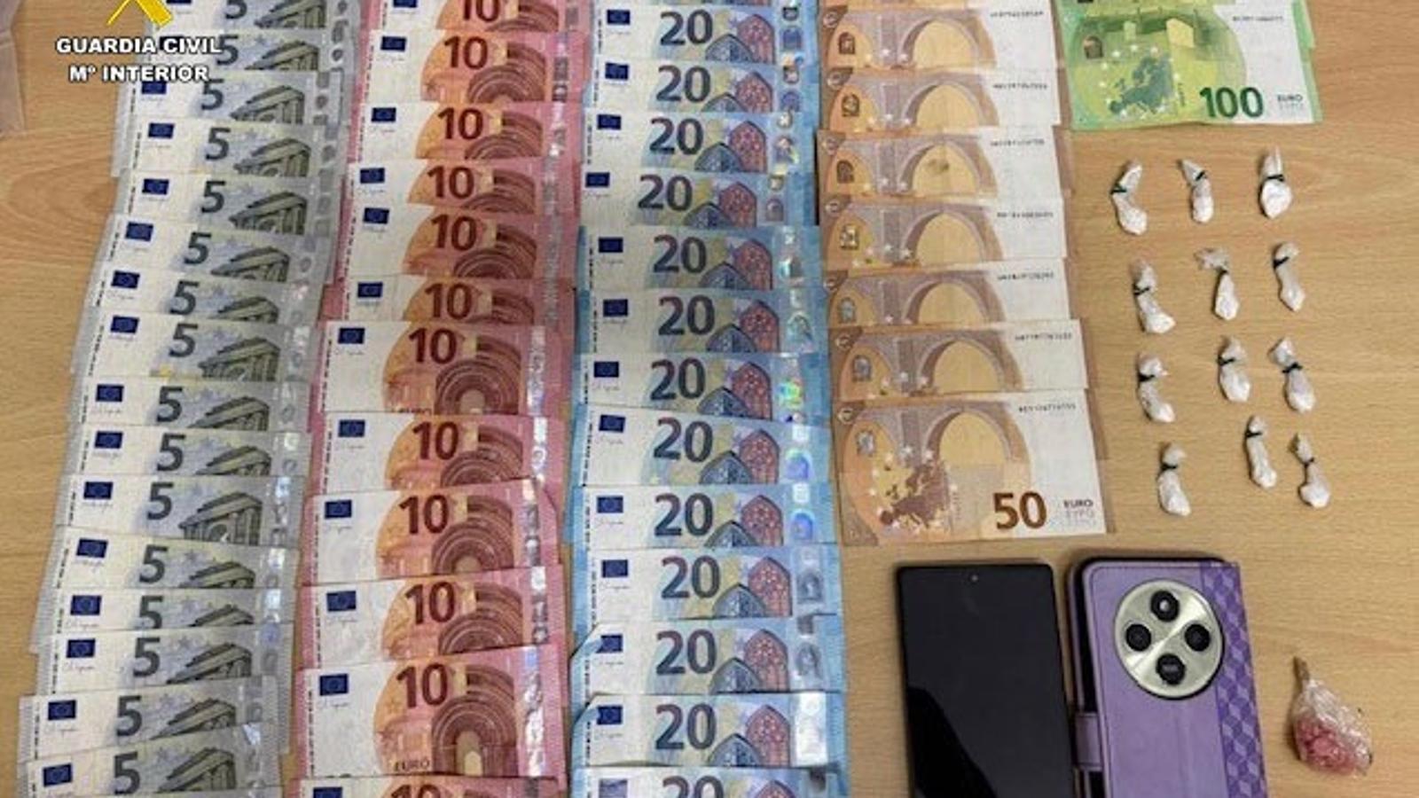 Money and drugs seized during the search