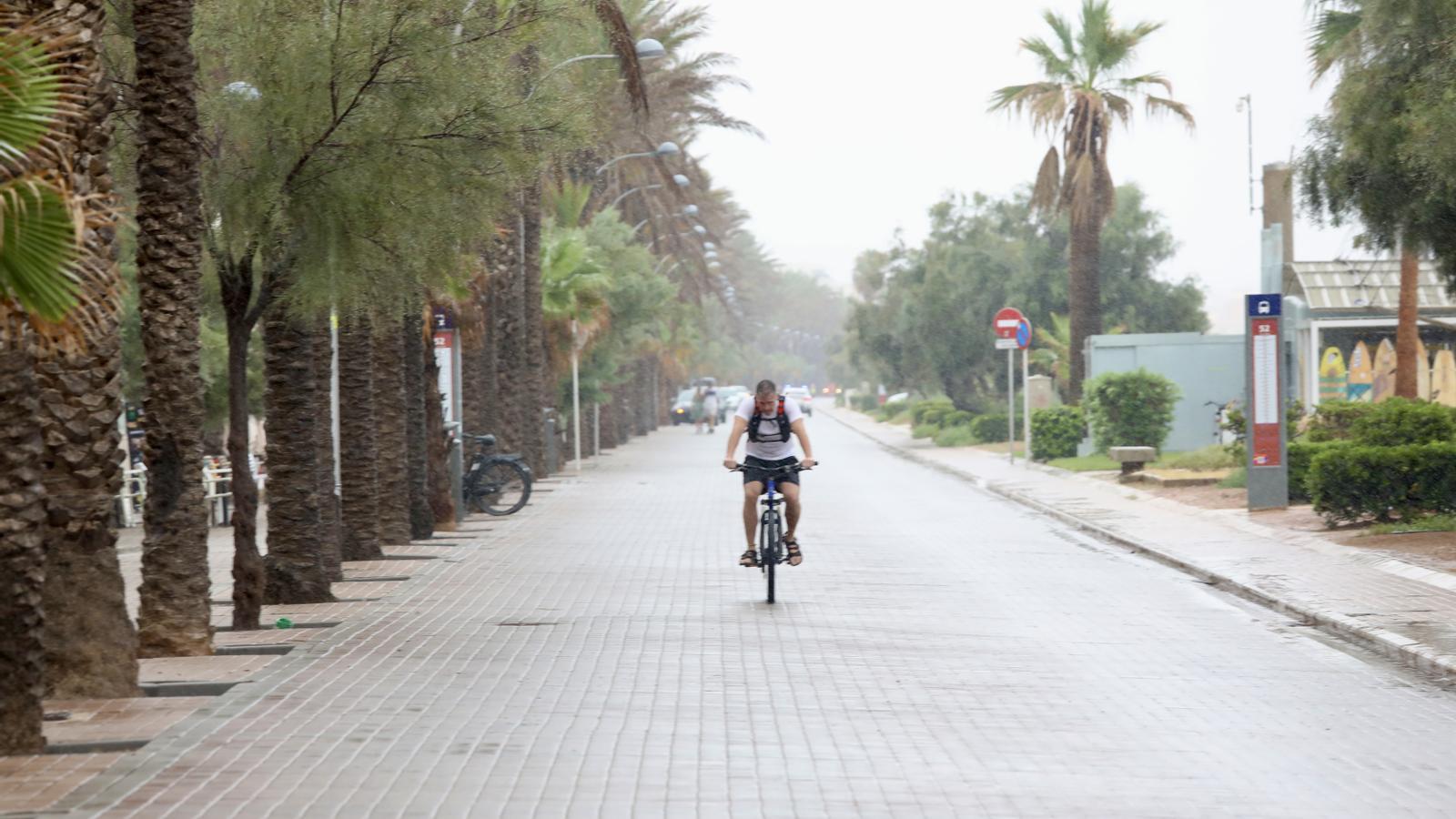 A cyclist in the rain.