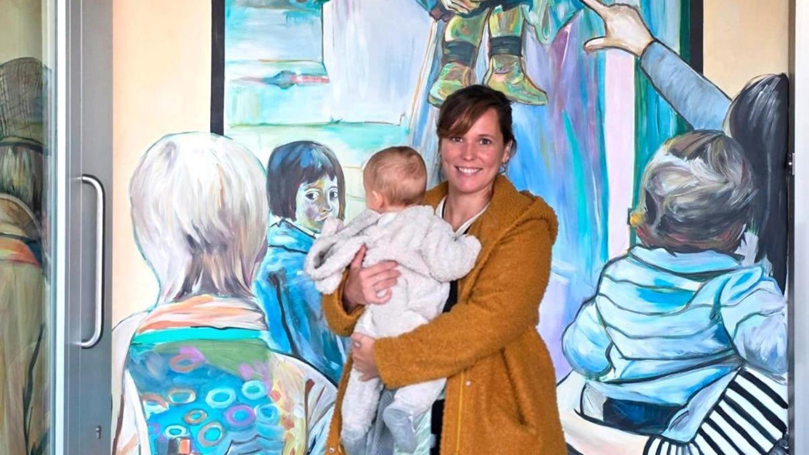 Lily Brick and her son at the mural of the Museum of Art of Montserrat