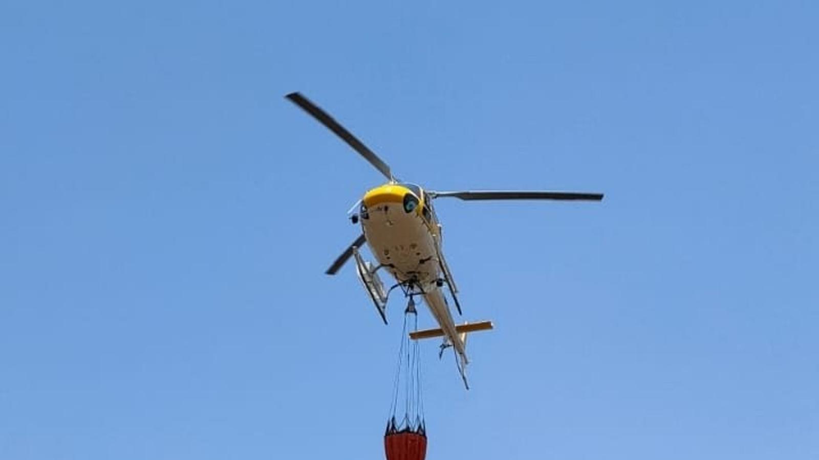 A helicopter operating on the fire