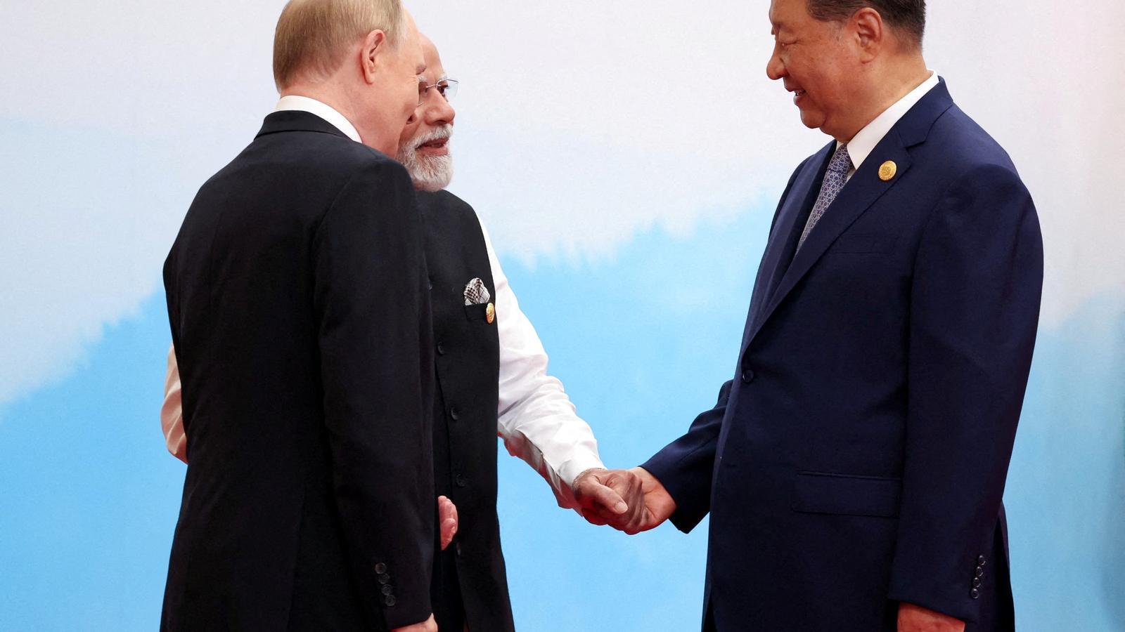 Vladimir Putin, Narendra Modi and Xi Jinping at the SCO summit in China.